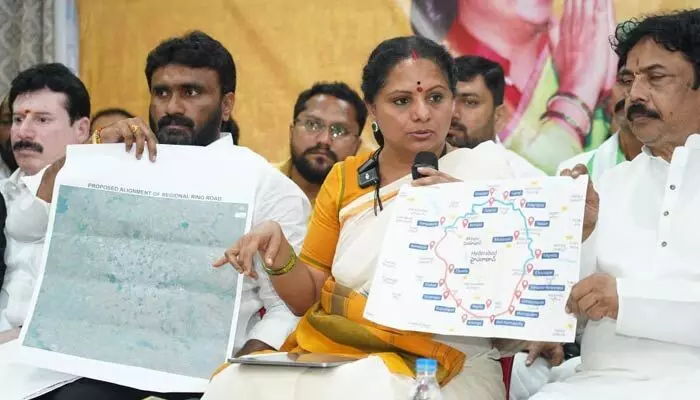 Kavitha alleges irregularities in Triple‑R land acquisition and demands a full re‑survey, questioning government silence on land grabs and injustices.